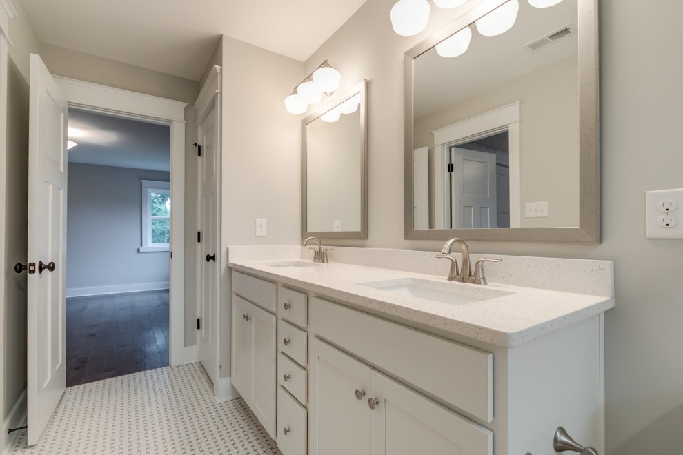 Example of a large country kids' white tile and subway tile ceramic tile, multicolored floor and double-sink alcove shower design in Richmond with recessed-panel cabinets, white cabinets, a two-piece toilet, gray walls, an undermount sink, solid surface countertops, a hinged shower door, white countertops and a built-in vanity