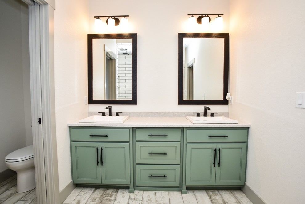 Inspiration for a large timeless master white tile and subway tile ceramic tile and gray floor corner shower remodel in Other with white walls, shaker cabinets, green cabinets, a two-piece toilet, a drop-in sink, quartz countertops and a hinged shower door