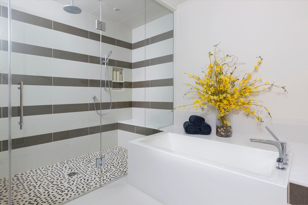 This is an example of a large contemporary ensuite bathroom in Milwaukee with a hinged door, a corner bath, a built-in shower, white walls and white floors.