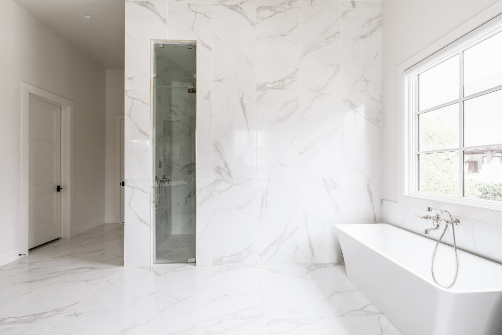 Photo of a large classic bathroom in Oklahoma City with white tiles and marble tiles.