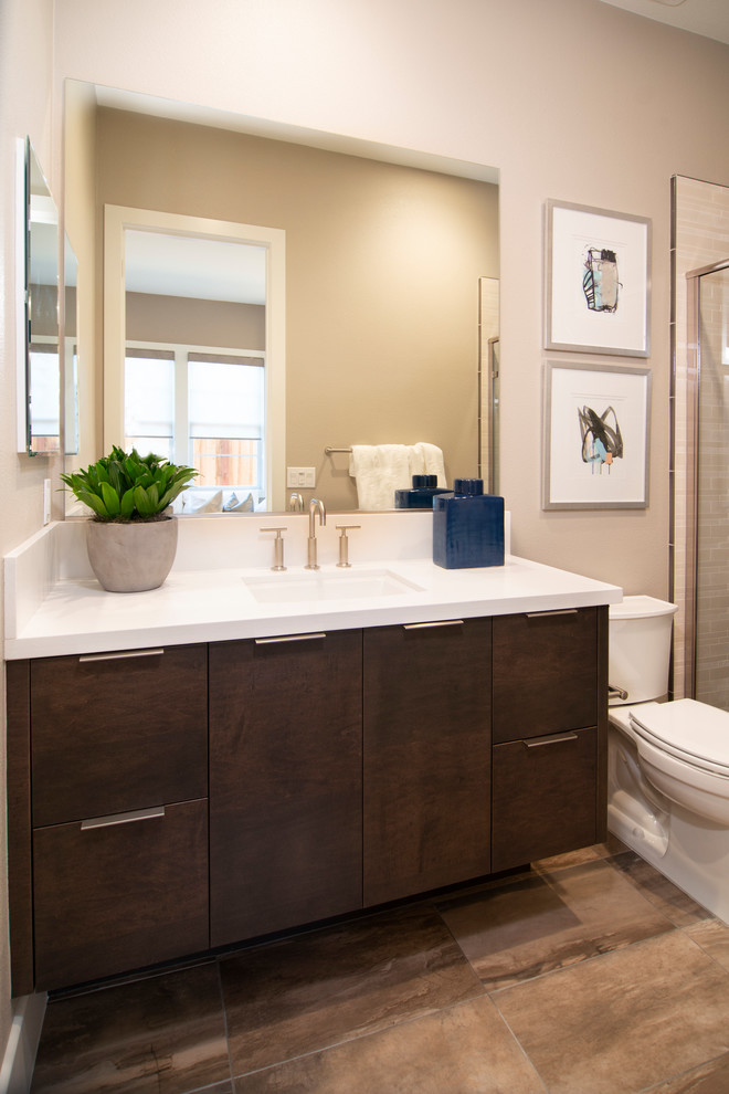 Example of a trendy bathroom design in San Francisco with flat-panel cabinets and dark wood cabinets