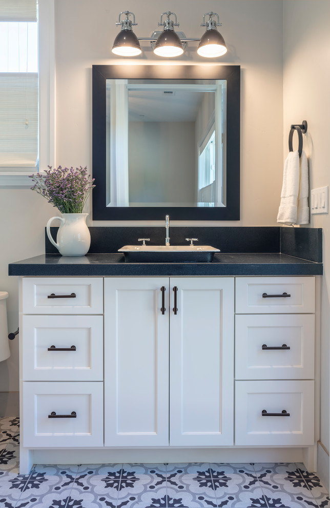 Photo of a classic bathroom in San Francisco with recessed-panel cabinets and white cabinets.