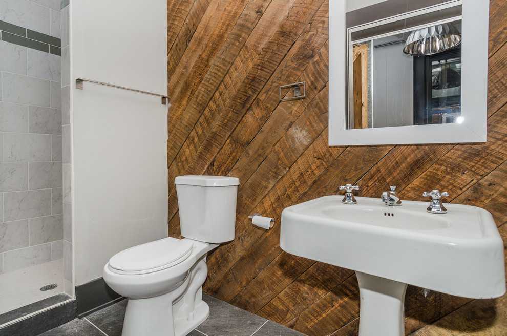 Example of a mid-sized urban 3/4 gray tile slate floor alcove shower design in Baltimore with a two-piece toilet, beige walls and a pedestal sink