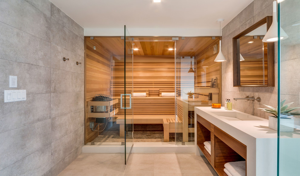 Inspiration for a contemporary gray tile beige floor sauna remodel in Los Angeles with open cabinets, medium tone wood cabinets, gray walls, an integrated sink and a hinged shower door