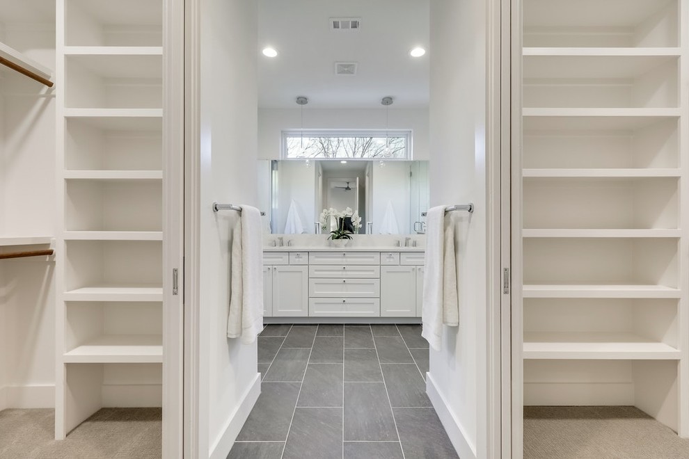 This is an example of a large modern ensuite bathroom in Austin with shaker cabinets, white cabinets, an alcove shower, white tiles, porcelain tiles, beige walls, laminate floors, a submerged sink, quartz worktops, brown floors, a hinged door and beige worktops.