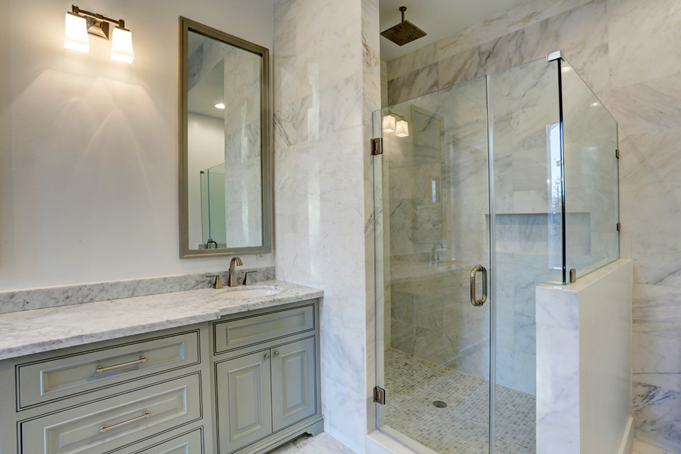 Inspiration for a large classic ensuite bathroom in Houston with a submerged sink, recessed-panel cabinets, green cabinets, marble worktops, a freestanding bath, a double shower, a one-piece toilet, white tiles, stone slabs, white walls and marble flooring.