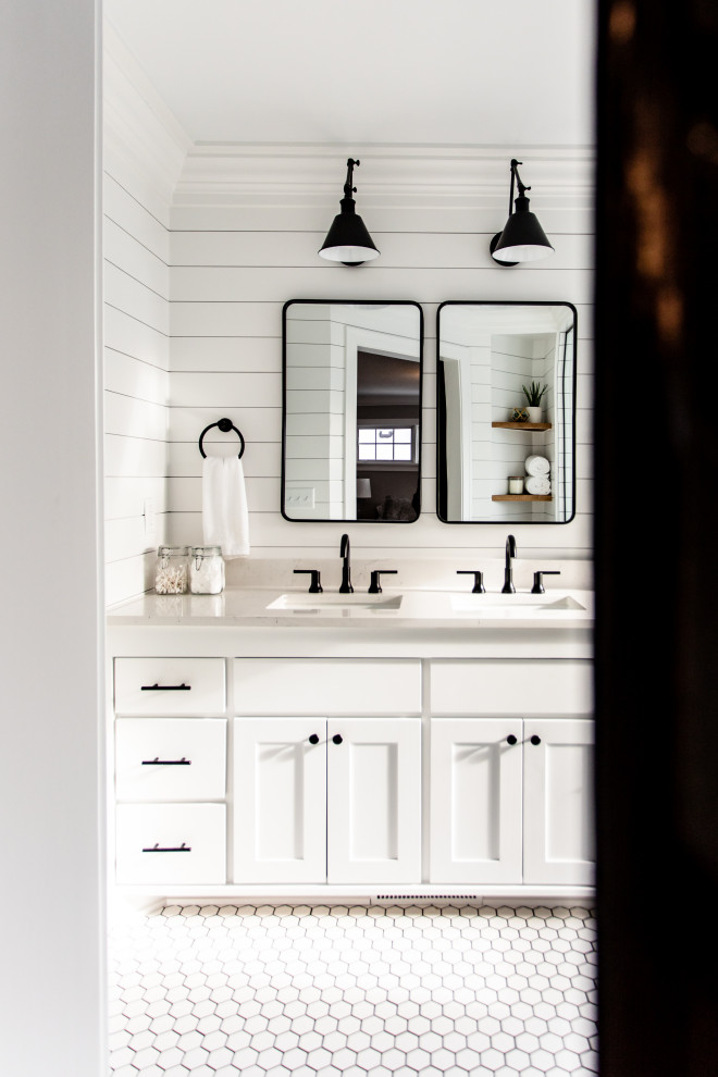 Inspiration for a large country master white tile and subway tile ceramic tile, white floor, double-sink and shiplap wall bathroom remodel in Minneapolis with shaker cabinets, white cabinets, a two-piece toilet, white walls, an undermount sink, quartz countertops, a hinged shower door, white countertops and a built-in vanity