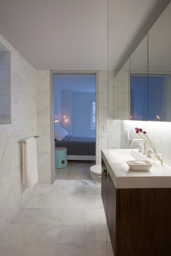 Contemporary bathroom in New York with an integrated sink.
