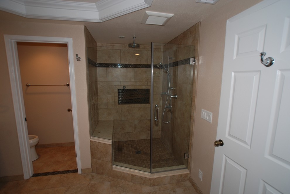 Large ensuite bathroom in Orange County with a submerged sink, recessed-panel cabinets, distressed cabinets, marble worktops, a submerged bath, an alcove shower, a two-piece toilet, beige tiles, porcelain tiles, white walls and porcelain flooring.