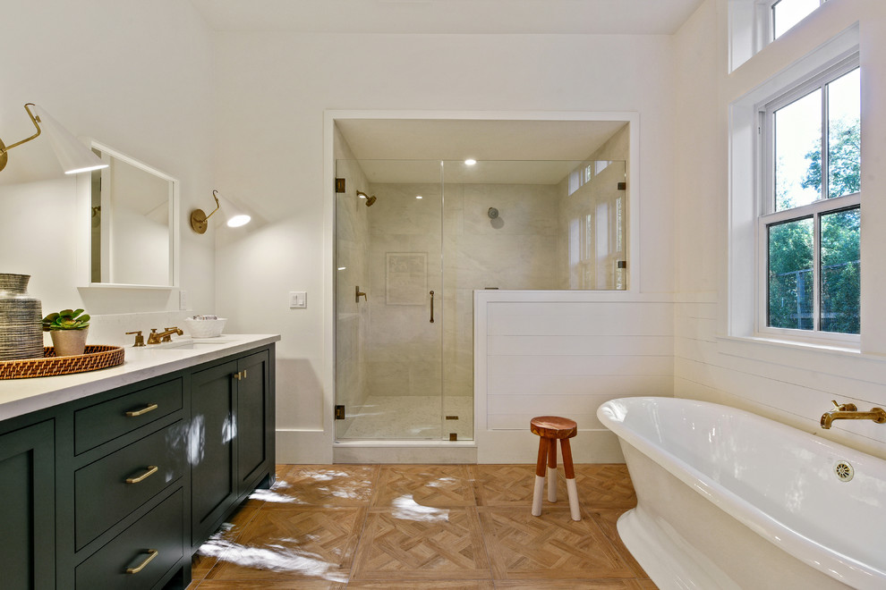 Transitional master bathroom photo in San Francisco with shaker cabinets and black cabinets