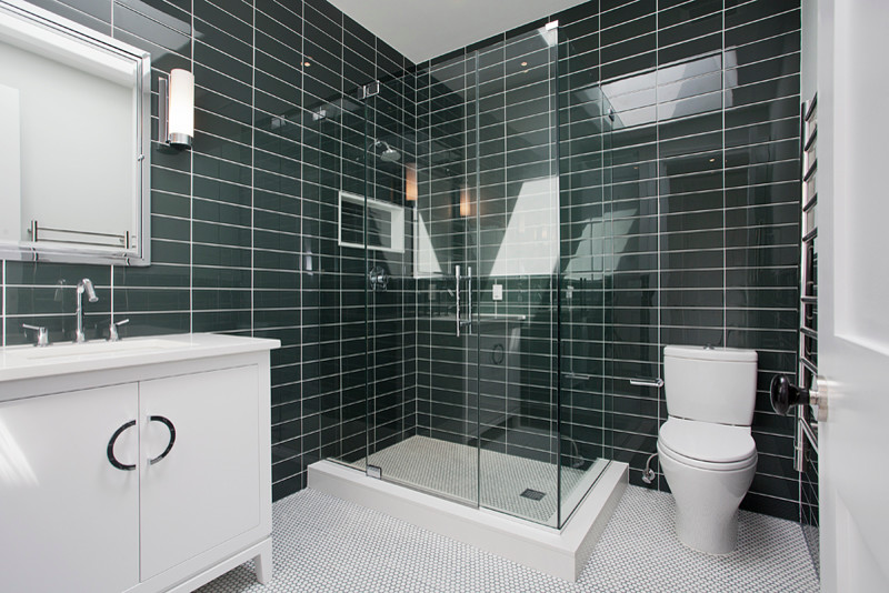 Medium sized traditional family bathroom in New York with a submerged sink, shaker cabinets, white cabinets, engineered stone worktops, a shower/bath combination, a two-piece toilet, grey tiles, stone tiles, grey walls and mosaic tile flooring.