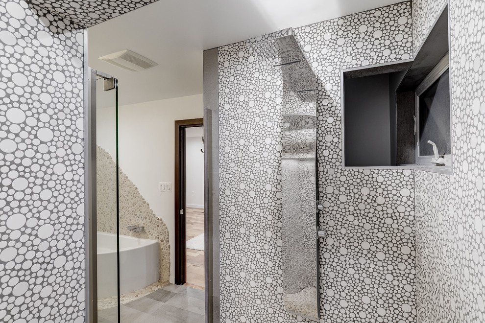 Example of a mid-sized trendy master mosaic tile medium tone wood floor bathroom design in DC Metro with raised-panel cabinets, dark wood cabinets, a one-piece toilet, gray walls, an integrated sink and solid surface countertops