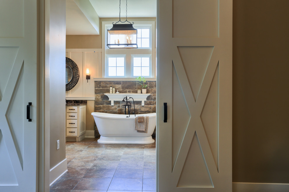 Large country master bathroom photo in Other with white cabinets, granite countertops and beige walls