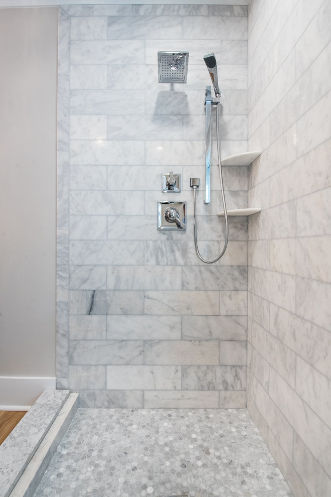 Mid-sized elegant master gray tile, white tile and stone tile medium tone wood floor doorless shower photo in Charleston with shaker cabinets, gray cabinets, gray walls, an undermount sink and granite countertops