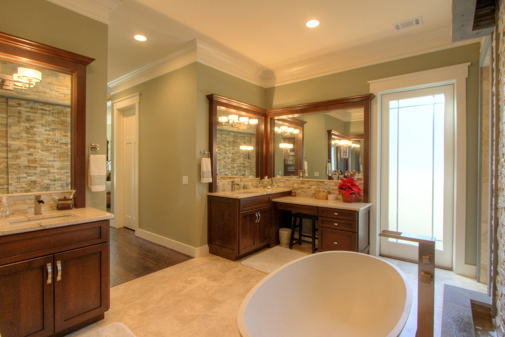 Arts and crafts master stone tile travertine floor bathroom photo in Atlanta with shaker cabinets, dark wood cabinets, an undermount sink and granite countertops
