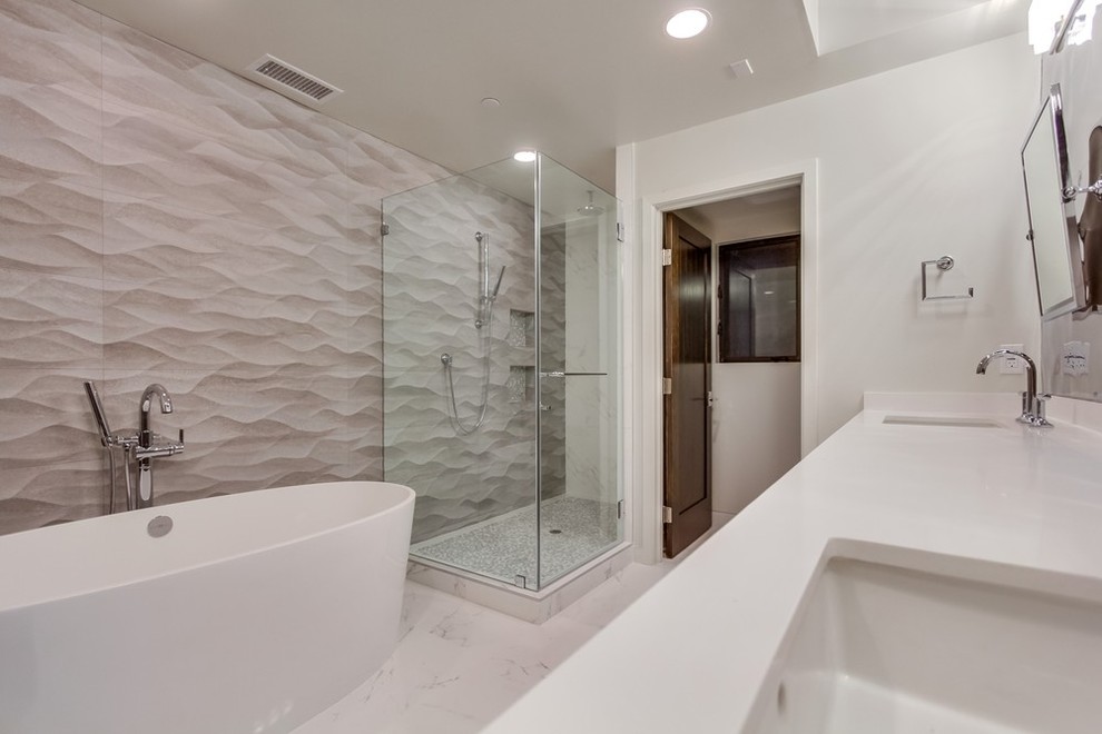 Large contemporary ensuite bathroom in Los Angeles with a submerged sink, flat-panel cabinets, light wood cabinets, engineered stone worktops, a freestanding bath, a shower/bath combination, a one-piece toilet, white walls and marble flooring.