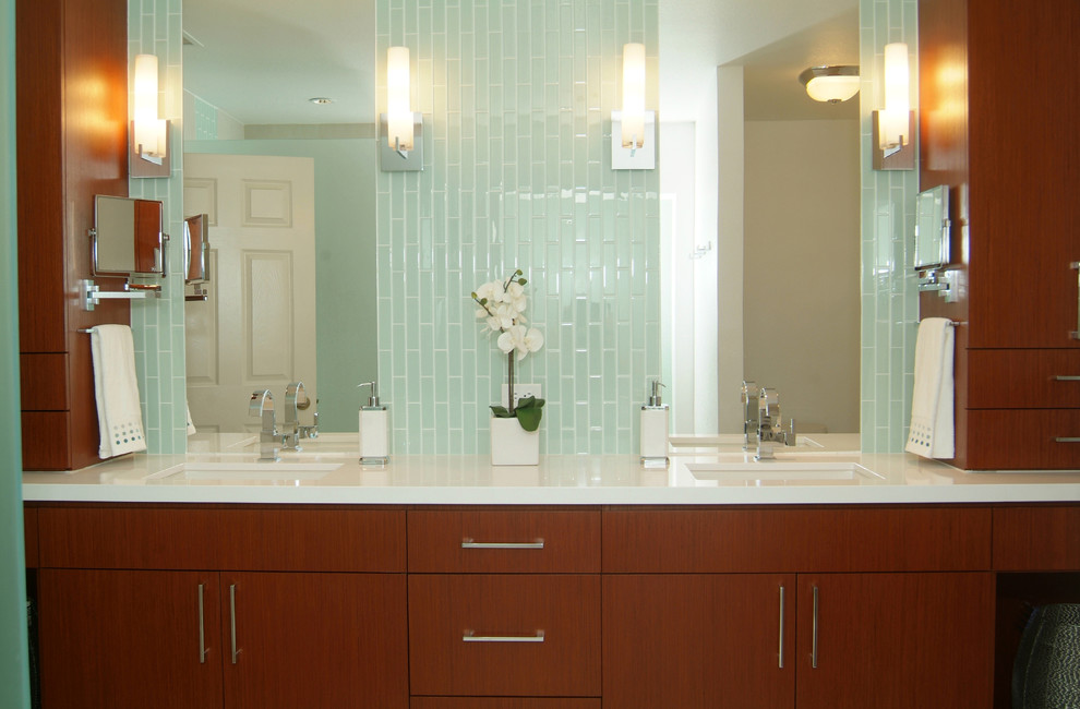 Bathroom - contemporary blue tile and glass tile bathroom idea in Phoenix with an undermount sink, flat-panel cabinets and dark wood cabinets