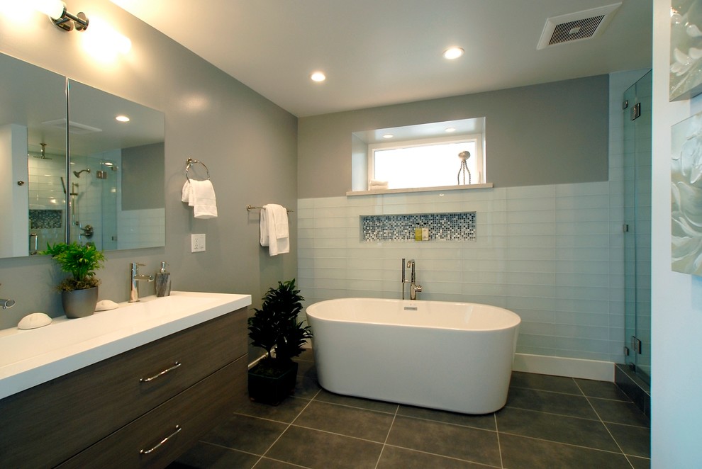 Example of a mid-sized trendy master white tile, blue tile and glass tile porcelain tile and brown floor bathroom design in San Francisco with flat-panel cabinets, medium tone wood cabinets, gray walls, an integrated sink, quartzite countertops and a hinged shower door