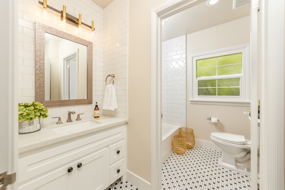 Example of a mid-sized classic master white tile and subway tile mosaic tile floor, multicolored floor and single-sink bathroom design in Sacramento with shaker cabinets, white cabinets, a one-piece toilet, beige walls, a drop-in sink, quartzite countertops, white countertops and a built-in vanity