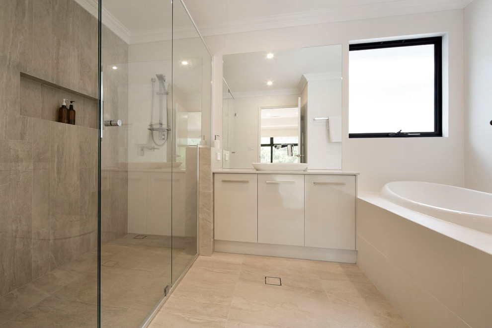 Modern ensuite bathroom in Perth with beige cabinets, a built-in bath, a double shower, a one-piece toilet, grey tiles, cement tiles, beige walls, ceramic flooring, solid surface worktops, grey floors, a sliding door and white worktops.