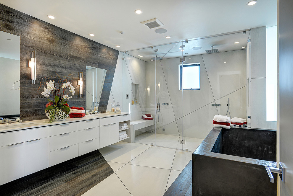 Inspiration for a contemporary ensuite bathroom in Los Angeles with a submerged sink, flat-panel cabinets, white cabinets, a freestanding bath and a built-in shower.