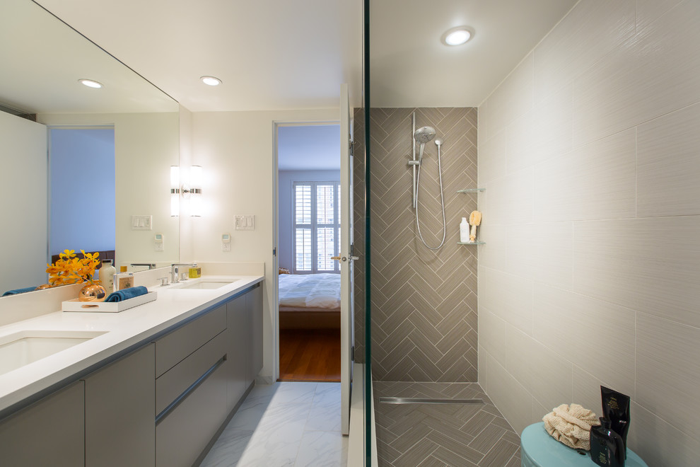 Inspiration for a mid-sized contemporary master brown tile and porcelain tile porcelain tile double shower remodel in Vancouver with flat-panel cabinets, beige cabinets, a one-piece toilet, white walls, an undermount sink and quartz countertops