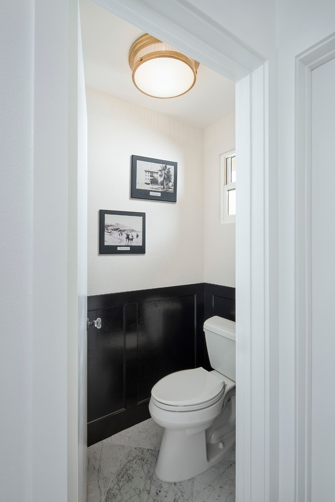 Inspiration for a mid-sized modern white tile and subway tile marble floor powder room remodel in San Francisco with recessed-panel cabinets, white cabinets, a two-piece toilet, white walls, an undermount sink and marble countertops