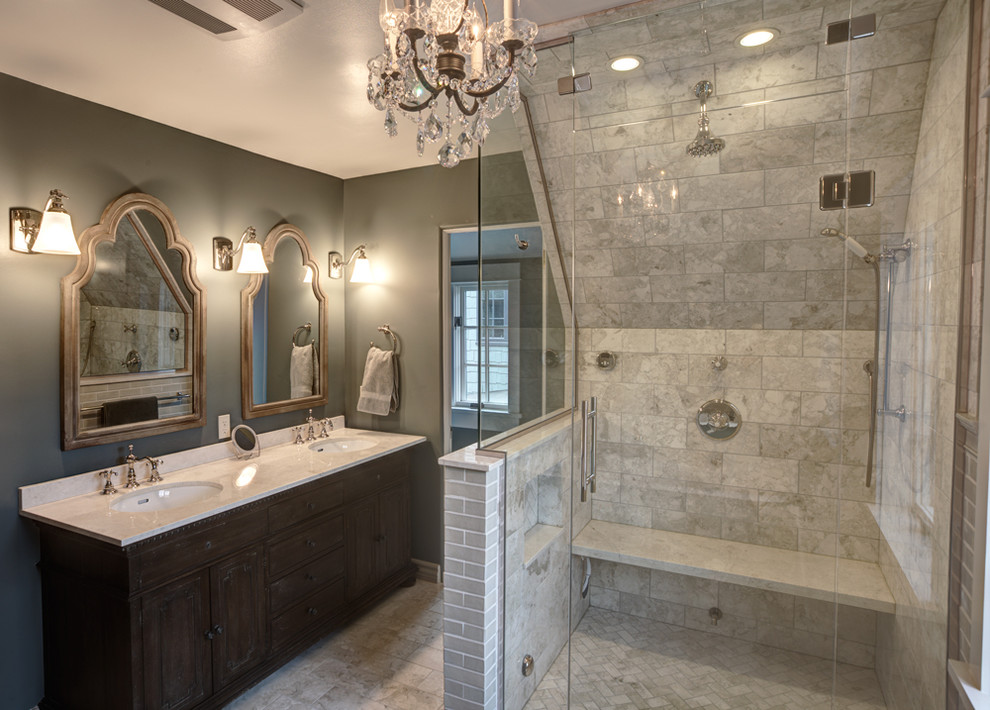 Example of a mid-sized trendy master beige tile and ceramic tile travertine floor bathroom design in Denver with green walls, an undermount sink, shaker cabinets, dark wood cabinets, marble countertops and a two-piece toilet