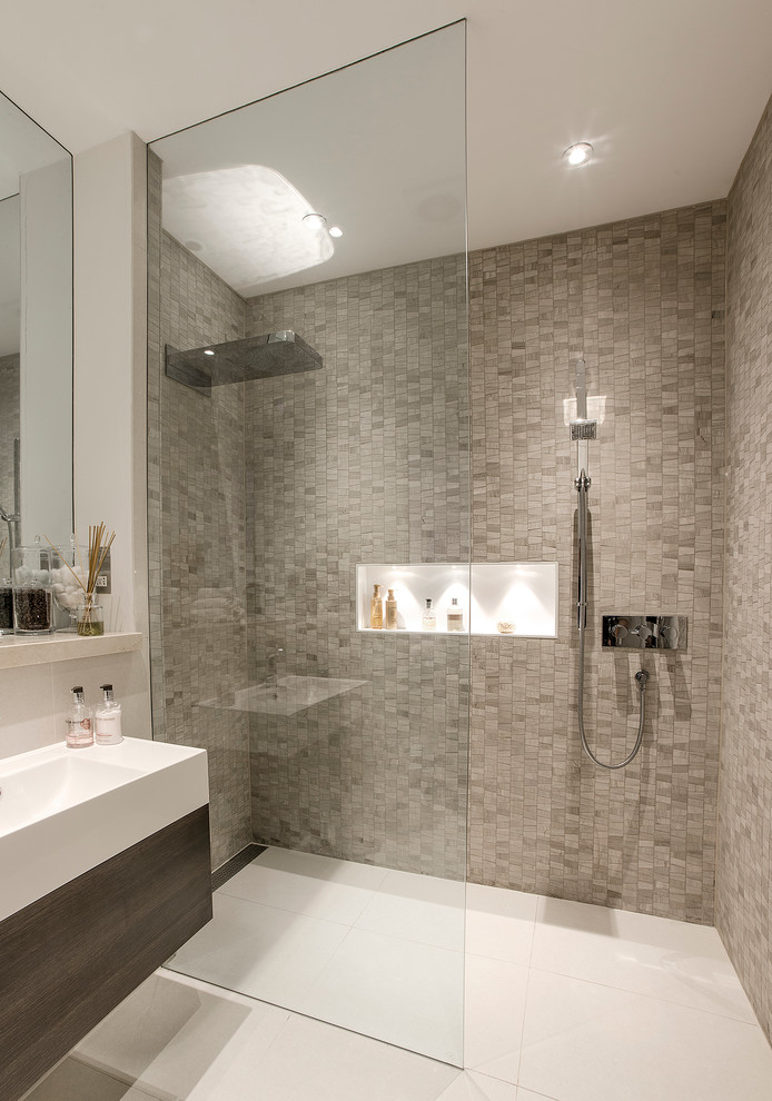 This is an example of a contemporary bathroom in London with a wall niche.