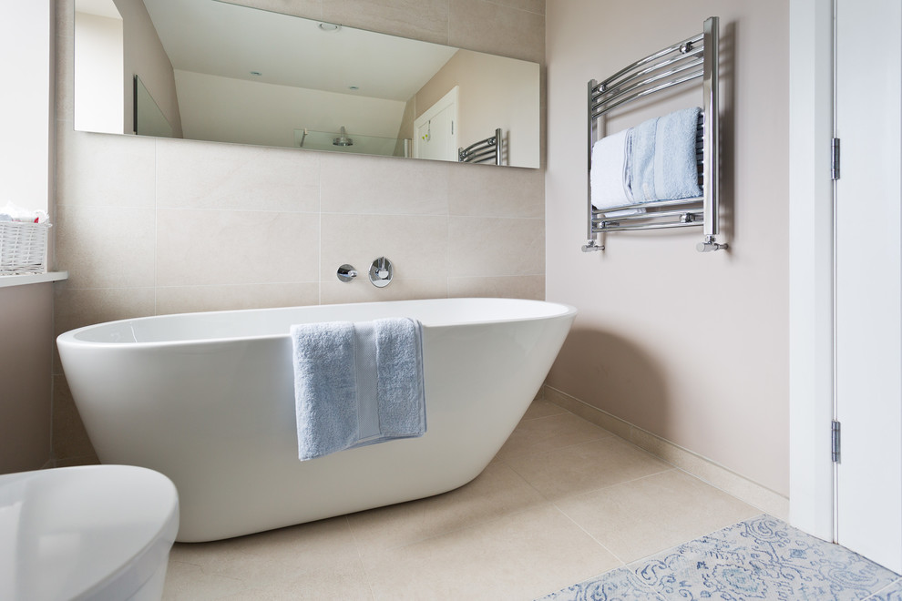 Inspiration for a medium sized scandi ensuite bathroom in Belfast with white cabinets, a freestanding bath, a walk-in shower, blue tiles, porcelain tiles, white walls and porcelain flooring.