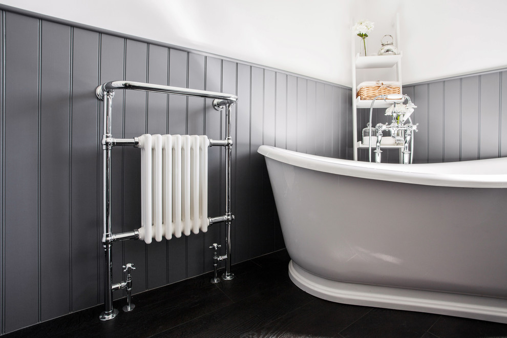 Medium sized contemporary family bathroom in Kent with flat-panel cabinets, grey cabinets, a freestanding bath, a corner shower, a wall mounted toilet, black and white tiles, white walls, dark hardwood flooring, a built-in sink, quartz worktops, an open shower and white worktops.
