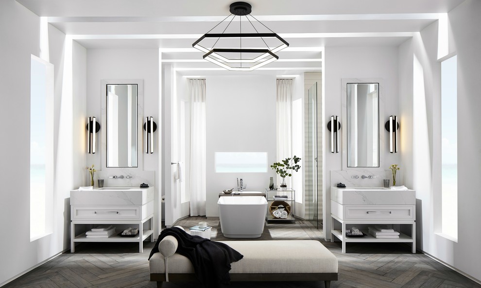 Bathroom - large contemporary master white tile and porcelain tile medium tone wood floor and gray floor bathroom idea in Los Angeles with shaker cabinets, white cabinets, a wall-mount toilet, white walls, an undermount sink, solid surface countertops and white countertops
