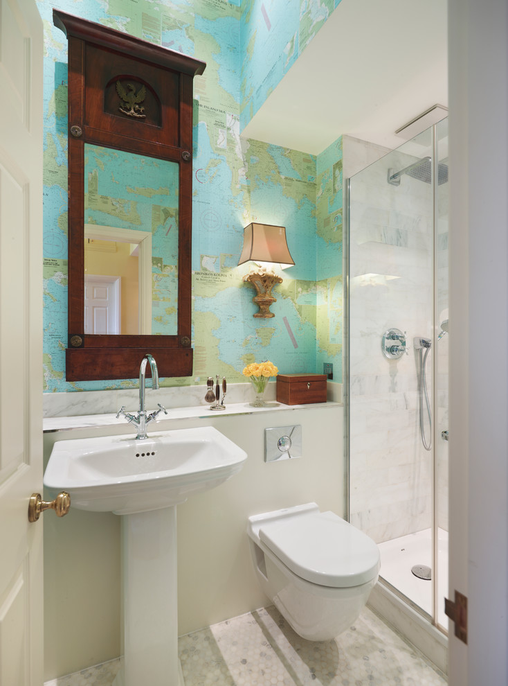 Example of a trendy white tile mosaic tile floor alcove shower design in London with a pedestal sink, a wall-mount toilet and multicolored walls