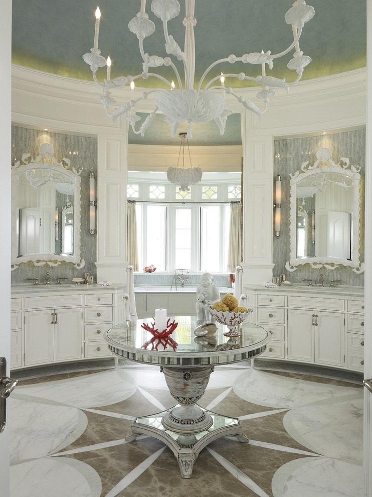Inspiration for a beach style bathroom in Miami with recessed-panel cabinets and white cabinets.