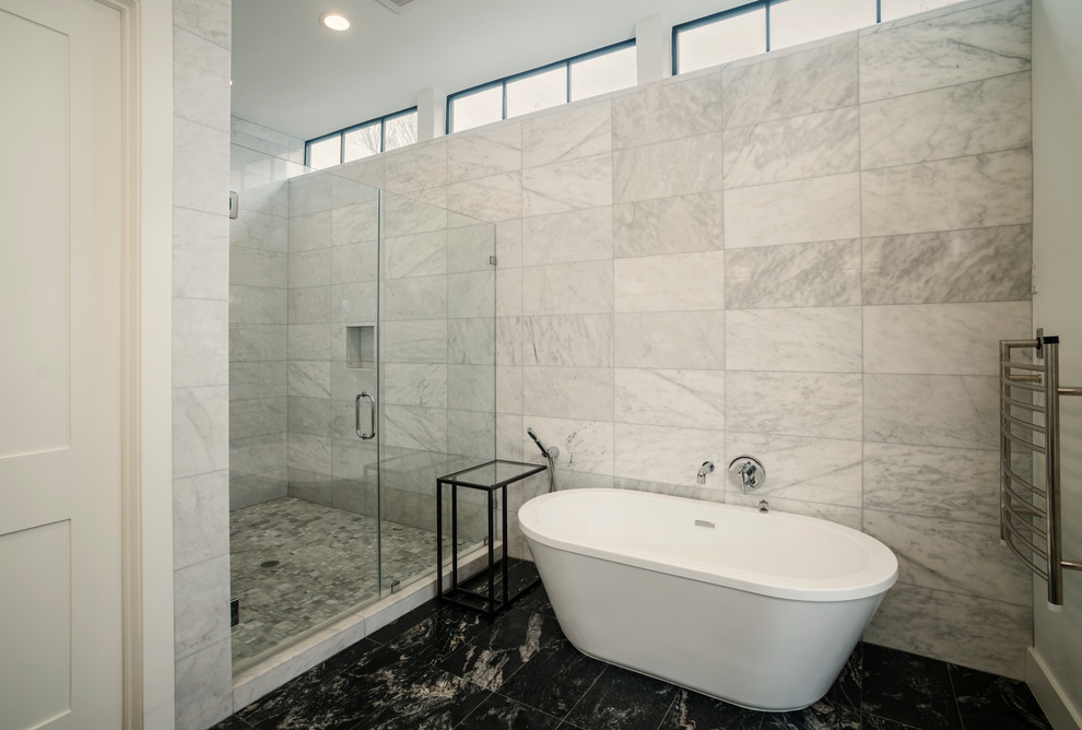Bathroom - mid-sized contemporary master white tile and marble tile marble floor and black floor bathroom idea in Houston with a one-piece toilet, white walls and a hinged shower door