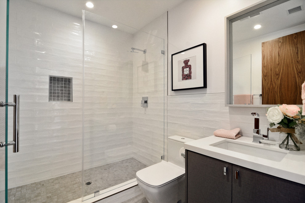 Bathroom - mid-sized modern white tile and cement tile cement tile floor, beige floor and single-sink bathroom idea in Los Angeles with flat-panel cabinets, dark wood cabinets, a one-piece toilet, white walls, an undermount sink, quartz countertops, white countertops and a floating vanity