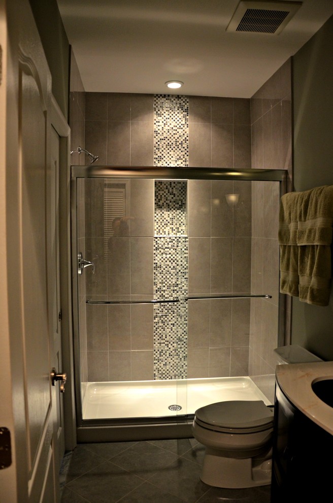Medium sized traditional shower room bathroom in DC Metro with a submerged sink, freestanding cabinets, dark wood cabinets, an alcove shower, a one-piece toilet, multi-coloured tiles, mosaic tiles, green walls and porcelain flooring.