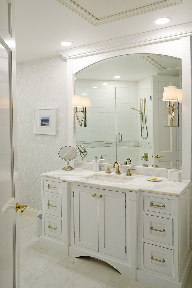 Bathroom - small transitional white tile and ceramic tile porcelain tile and white floor bathroom idea in Miami with beaded inset cabinets, white cabinets, a one-piece toilet, gray walls, an undermount sink, quartzite countertops and a hinged shower door