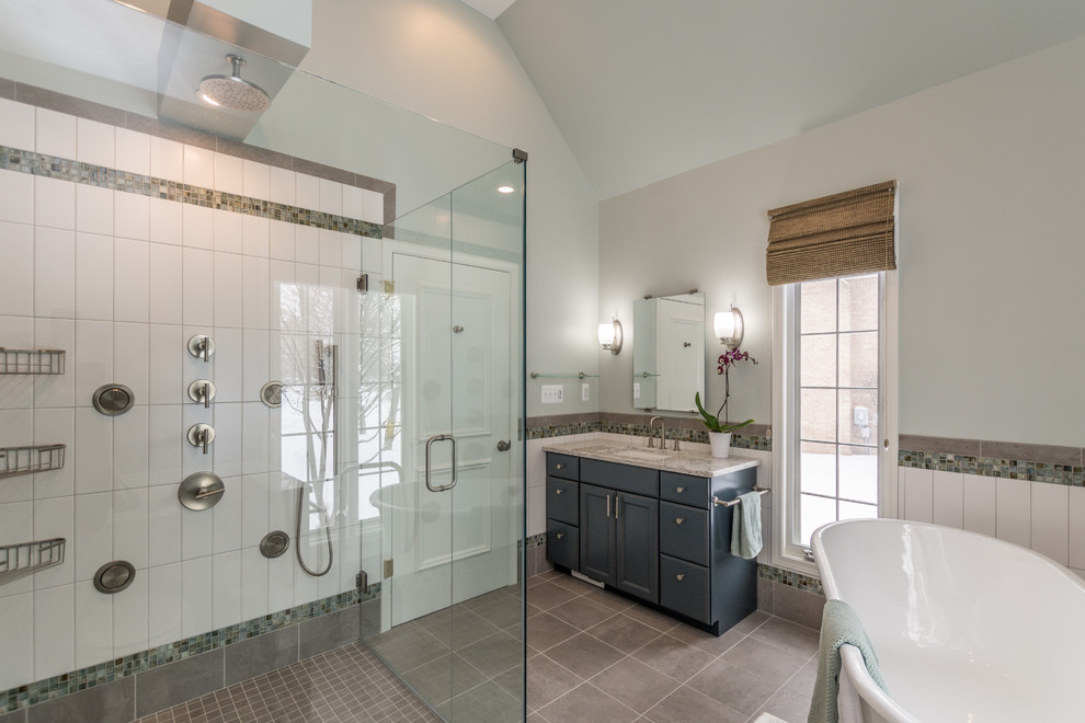 Inspiration for a large transitional master white tile and ceramic tile ceramic tile and gray floor bathroom remodel in Detroit with flat-panel cabinets, blue cabinets, a two-piece toilet, green walls, an undermount sink, quartz countertops, a hinged shower door and white countertops