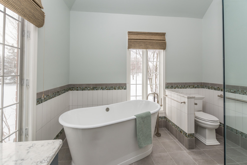 Large transitional master white tile and ceramic tile ceramic tile and gray floor bathroom photo in Detroit with flat-panel cabinets, blue cabinets, a two-piece toilet, green walls, an undermount sink, quartz countertops, a hinged shower door and white countertops