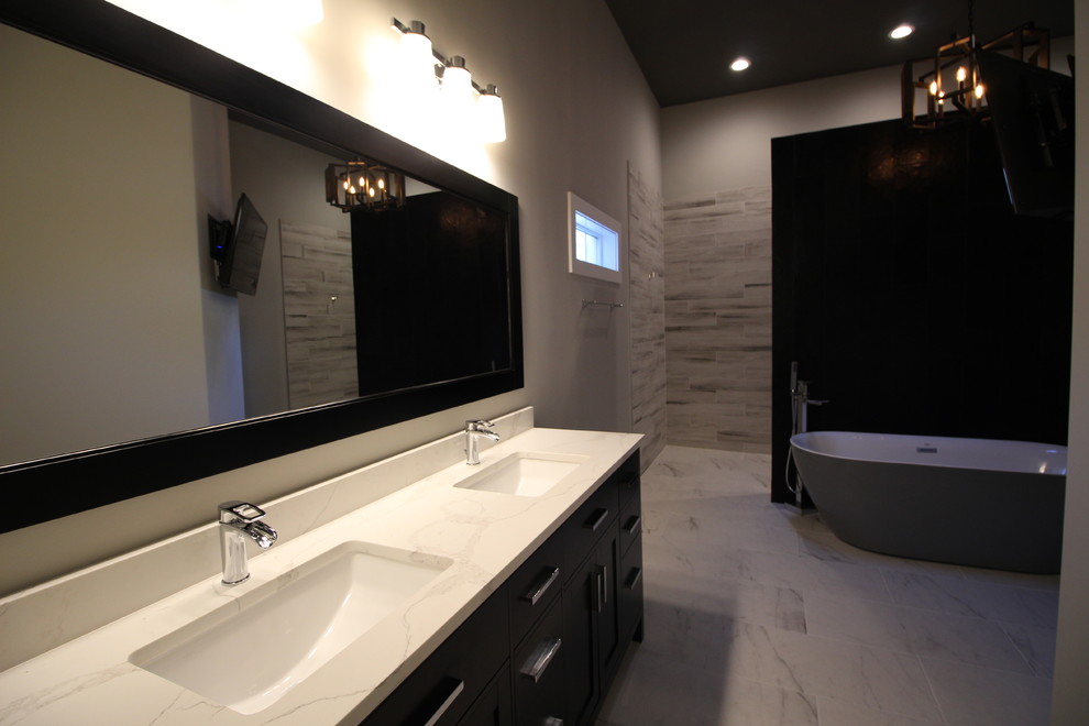 Example of a minimalist gray tile and porcelain tile marble floor and gray floor bathroom design in Nashville with dark wood cabinets, brown walls, an undermount sink and marble countertops