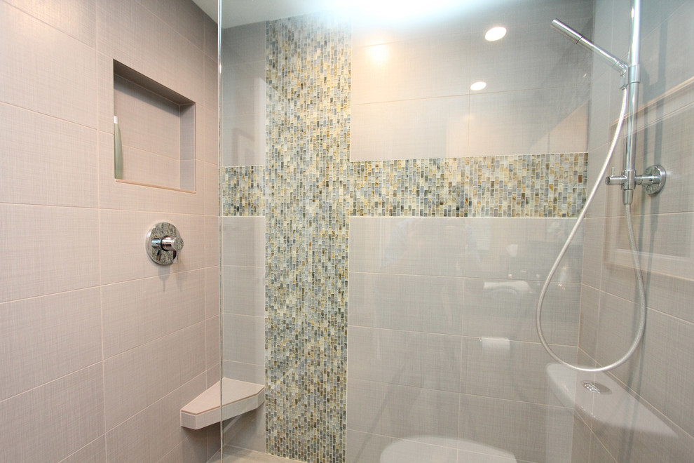 Doorless shower - mid-century modern gray tile and porcelain tile doorless shower idea in Hawaii with an undermount sink, flat-panel cabinets, light wood cabinets, granite countertops and a two-piece toilet