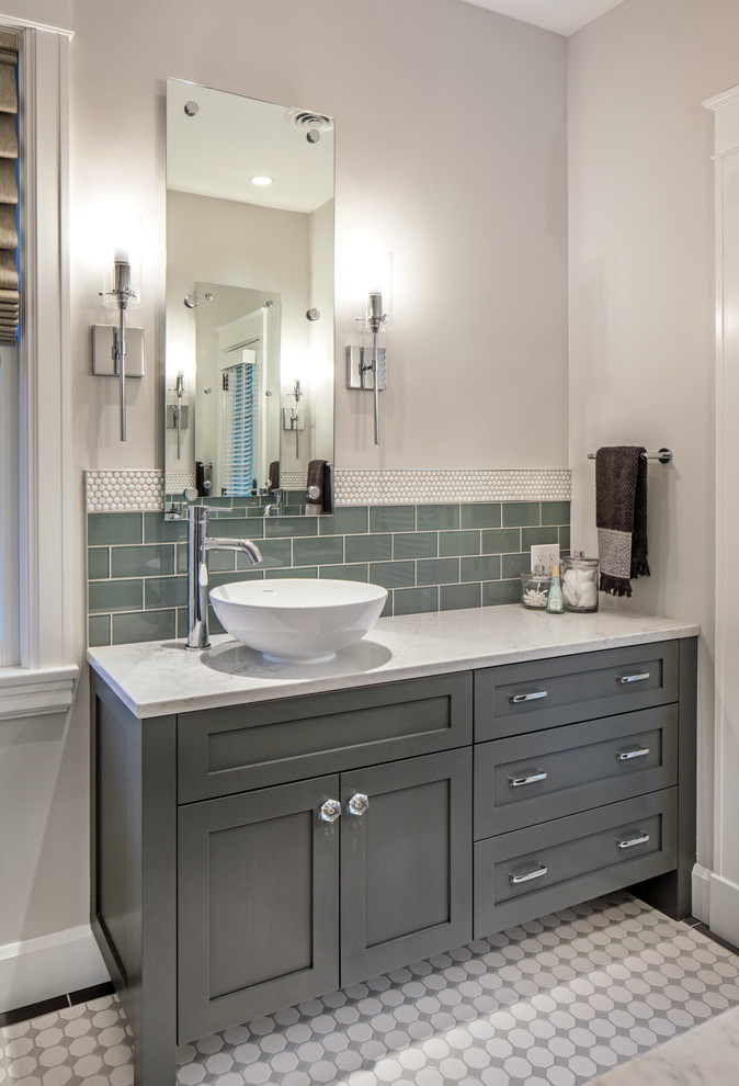 Bathroom - small transitional master white tile and porcelain tile porcelain tile and white floor bathroom idea in Omaha with furniture-like cabinets, gray cabinets, a one-piece toilet, white walls, a vessel sink, quartz countertops and a hinged shower door