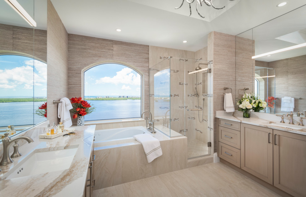 Exemple d'une grande salle de bain chic en bois clair avec un placard avec porte à panneau encastré, une baignoire posée, un carrelage beige, un lavabo encastré, un sol beige, un plan de toilette blanc, meuble double vasque, meuble-lavabo encastré et un plafond décaissé.