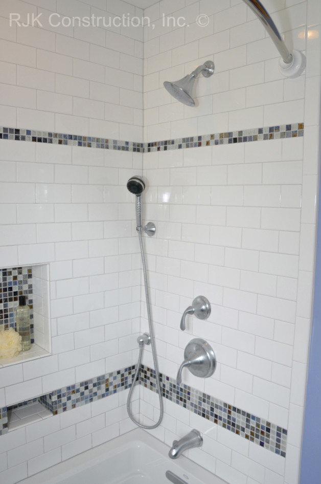 Inspiration for a classic ensuite bathroom in DC Metro with a submerged sink, raised-panel cabinets, dark wood cabinets, granite worktops, an alcove bath, an alcove shower, blue tiles and blue walls.