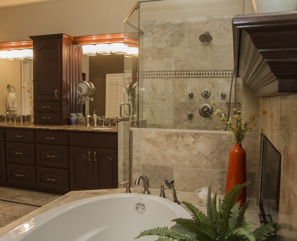 Example of a classic multicolored tile corner shower design in Dallas with dark wood cabinets, granite countertops and a one-piece toilet