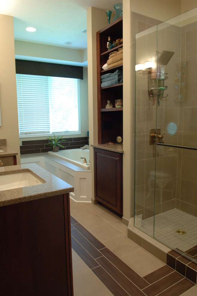 Photo of a classic bathroom in Other with a submerged sink, raised-panel cabinets, dark wood cabinets, engineered stone worktops, an alcove shower, beige tiles and ceramic tiles.