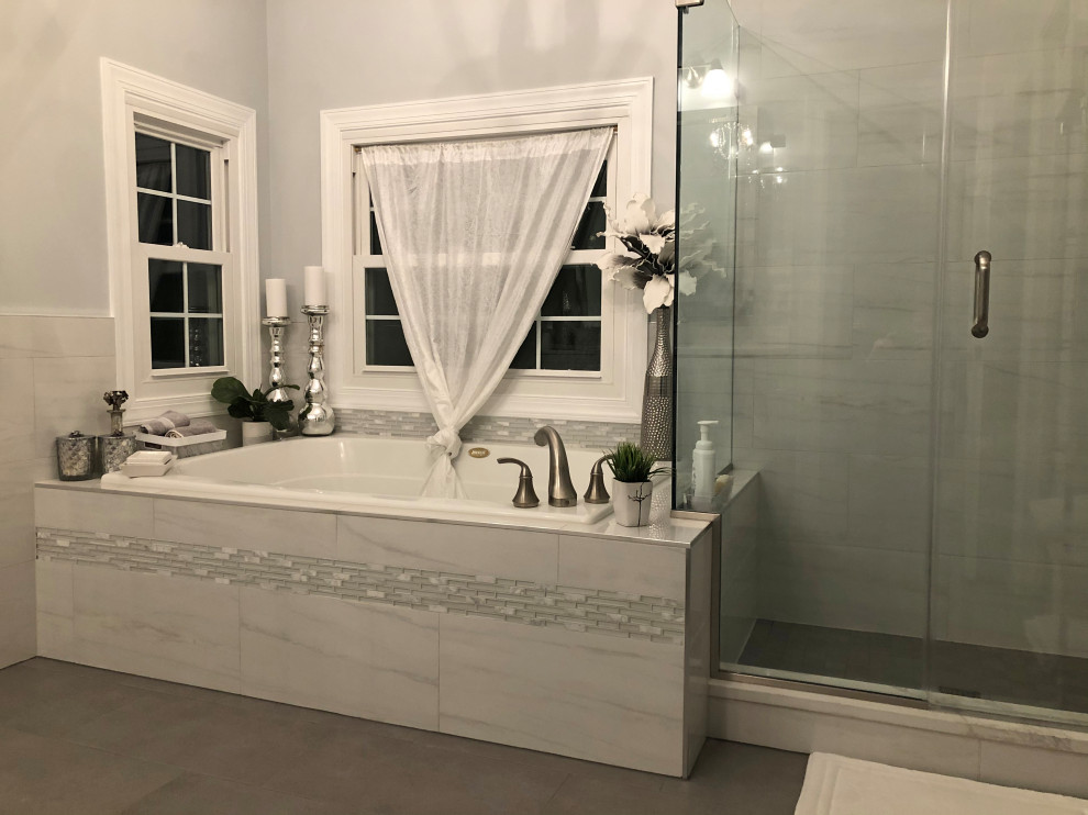 Inspiration for a medium sized classic ensuite bathroom in Baltimore with shaker cabinets, white cabinets, a built-in bath, a corner shower, a two-piece toilet, grey tiles, marble tiles, grey walls, a submerged sink, engineered stone worktops, yellow floors, a sliding door, white worktops, an enclosed toilet, double sinks and a built in vanity unit.