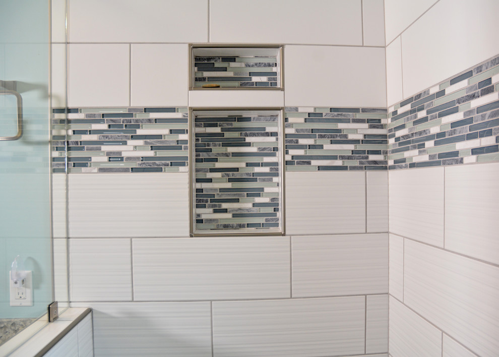 Inspiration for a mid-sized transitional master white tile and ceramic tile ceramic tile and multicolored floor alcove shower remodel in Other with shaker cabinets, white cabinets, a two-piece toilet, gray walls, an undermount sink, quartz countertops, a hinged shower door and multicolored countertops