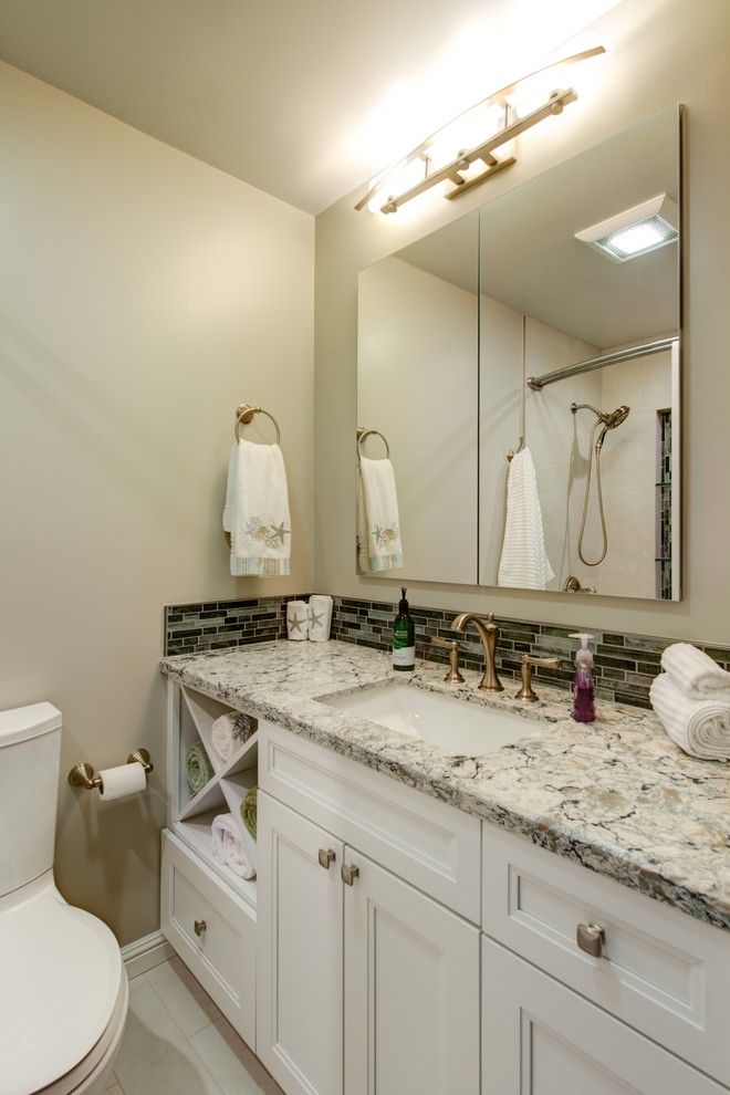 Mid-sized transitional green tile and glass sheet porcelain tile bathroom photo in San Francisco with recessed-panel cabinets, white cabinets, a two-piece toilet, an undermount sink and quartz countertops